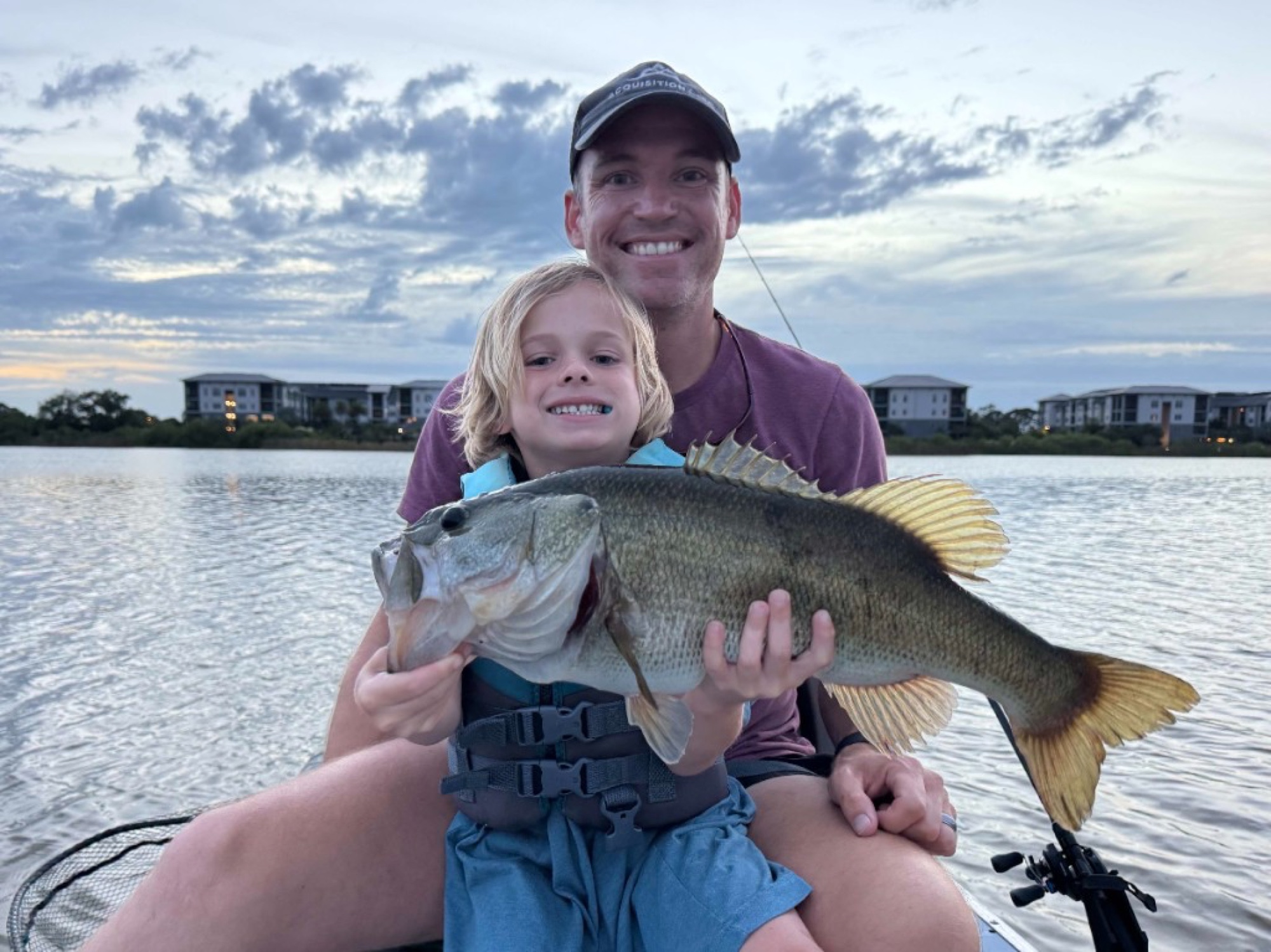 Jordan and Oliver with a largemouth bass